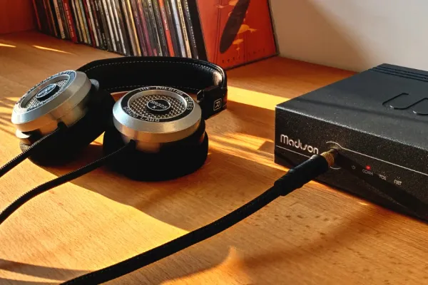 Control4 Touch panel in a able with a traditional home in the background